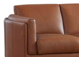 Brown leather sofa with a close-up of the armrest on a white background