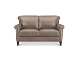 A classic two-seater loveseat sofa upholstered in taupe leather, featuring rolled arms with nailhead trim and dark wood legs, shown against a plain white background.