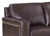 Close-up of a brown leather sofa with visible stitching details.