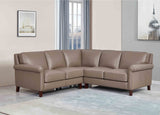 Brown leather sectional sofa in a living room setting with decor elements.