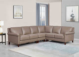 Brown leather sectional sofa in a living room setting with decor elements.