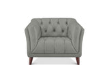 A light gray tufted armchair with dark brown wooden legs, shown from a front-facing perspective on a solid white background.