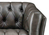 Brown leather sofa with tufted backrest on a white background