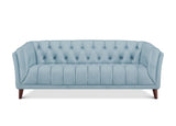 A light blue tufted loveseat sofa with dark brown wooden legs, shown from a front-facing perspective on a solid white background.