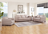 Gray sofa set in a living room with large windows and decor.