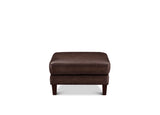 A dark brown upholstered ottoman with a square cushion and short dark legs, shown against a plain white background.