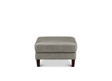 A square upholstered ottoman in light gray fabric with dark brown wooden legs, shown against a plain white background.