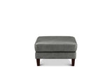 A square gray upholstered ottoman with dark brown wooden legs, shown from the front against a plain white background.