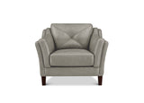 A light gray upholstered armchair with a diamond-quilted backrest, curved arms, and dark brown wooden legs, shown against a plain white background.