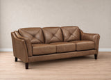 A three-seat brown leather sofa with diamond tufting on the back cushions, set against a neutral beige wall and light wood floor.