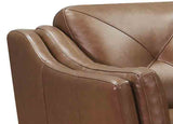 Close-up of a brown leather sofa with visible stitching