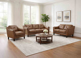 Brown leather sofa set in a living room with a coffee table and decor.