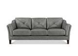 A three-seat gray upholstered sofa with diamond-quilted back cushions, rolled arms, and dark wooden legs, shown against a plain white background.