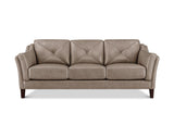 A three-seat sofa upholstered in taupe leather with diamond-quilted back cushions and dark wooden legs, shown against a plain white background.