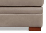 Close-up of a beige upholstered chair with a wooden leg on a white background