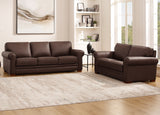 Brown leather sofa set in a living room with a rug and bookshelf.
