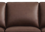 Brown leather sofa with a close-up view of the seat cushion.