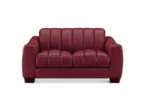 A modern two-seater loveseat sofa upholstered in deep burgundy leather, featuring vertical channel tufting on the backrest and seat cushions, set against a plain white background.