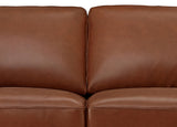 Brown leather sofa with a close-up view of the cushions.