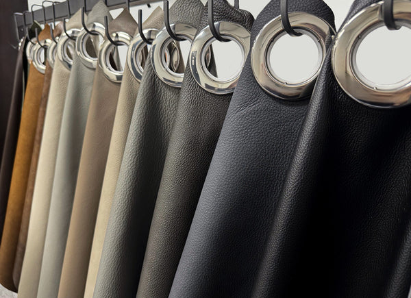 High-quality leather swatches in neutral tones, showcasing texture.