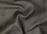 A close-up of dark charcoal gray textured leather fabric with soft folds and a pebbled grain surface.