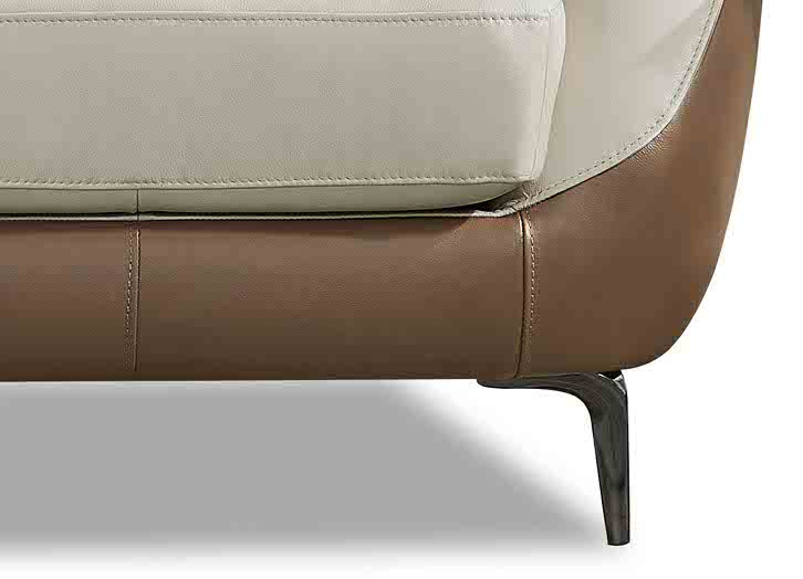 Close-up of a modern sofa with beige and brown leather on a white background