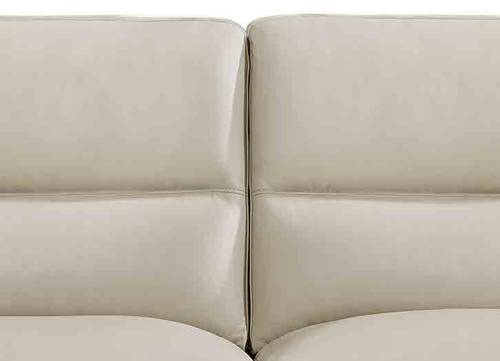 Close-up of a beige leather sofa corner