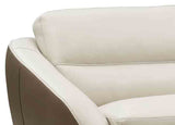 Close-up of a beige leather sofa with a focus on texture and color.
