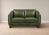 A two-seater loveseat sofa upholstered in olive green leather, shown from the front against a neutral beige wall and light wood floor.