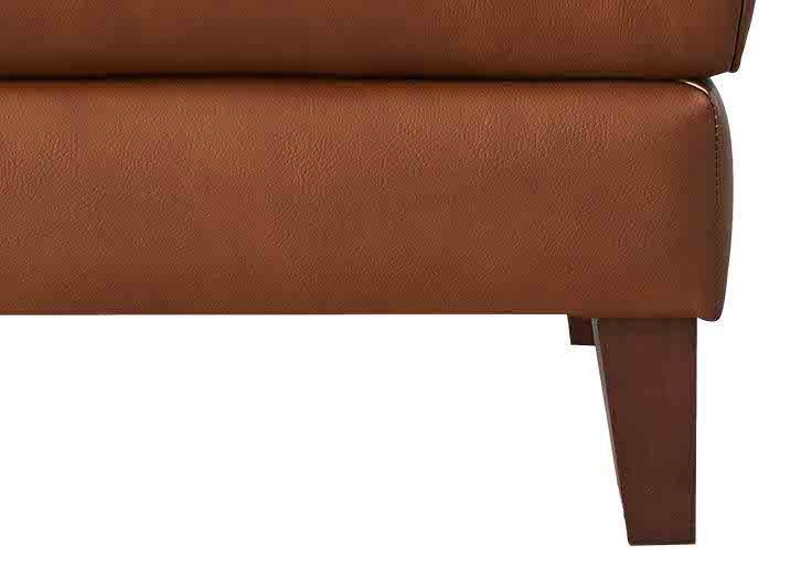 Close-up of a brown leather armchair on a white background