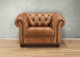 Brown leather sofa against a gray wall