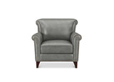 A classic wingback armchair upholstered in textured gray leather with rolled arms, nailhead trim, and dark wood legs, shown against a plain white background.
