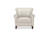 An off-white leather wingback armchair with dark brown wooden legs and silver nailhead trim, shown against a plain white background.