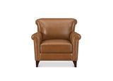 A classic brown leather armchair with rolled arms, nailhead trim, and dark wooden legs, shown against a plain white background.