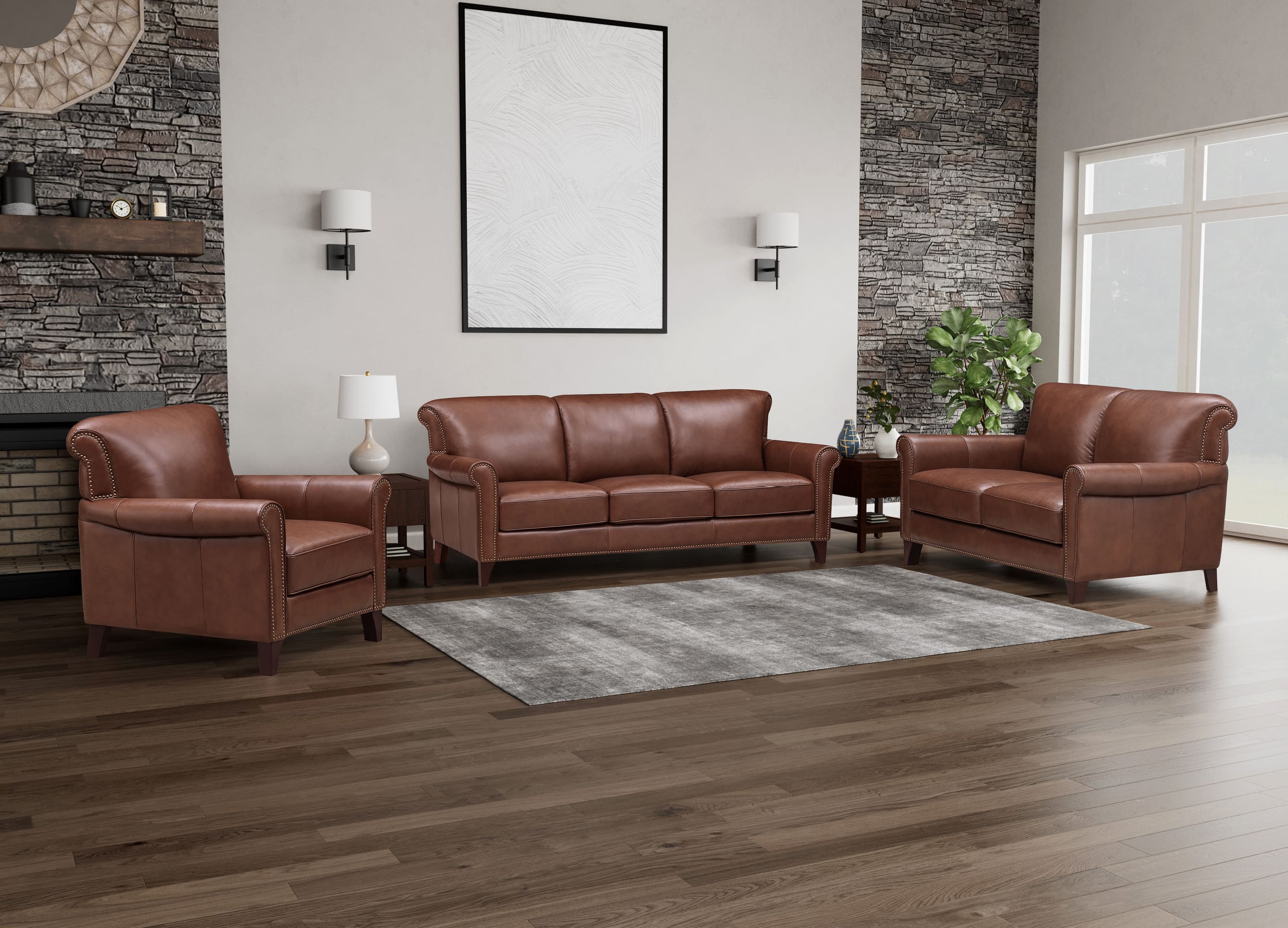 Brown leather sofa set in a living room with wooden flooring and a fireplace.
