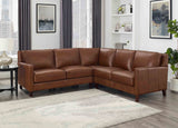 Brown leather sectional sofa in a living room setting with decor elements.