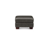A dark gray upholstered ottoman with dark brown wooden legs, shown from the front against a plain white background.