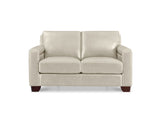 A modern two-seater loveseat sofa upholstered in light beige leather, featuring dark brown wooden legs, shown against a plain white background.