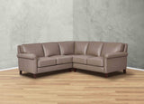 Brown leather sectional sofa in a room with a gray wall and wooden floor.