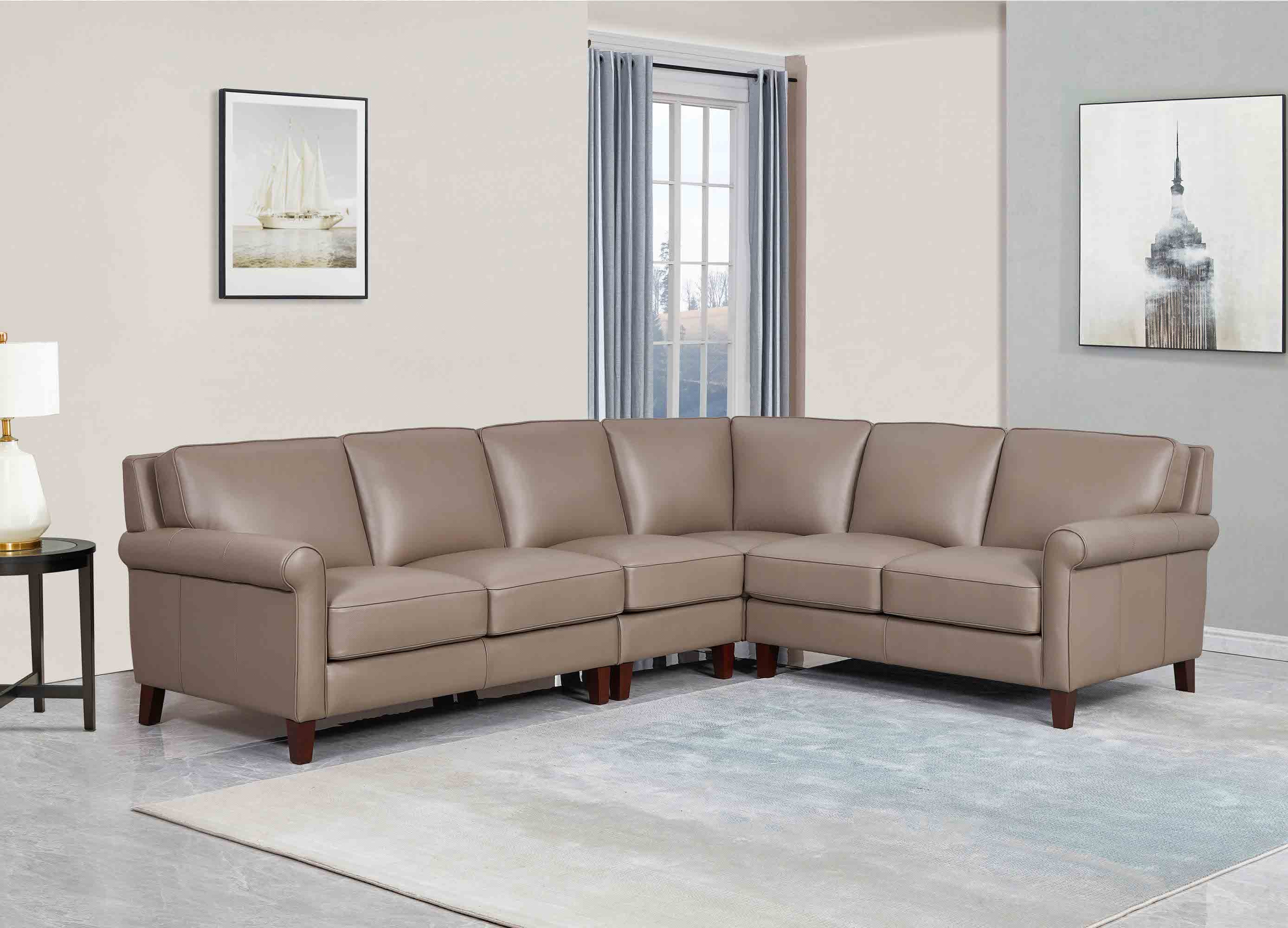 Brown leather sectional sofa in a living room setting with decor elements.