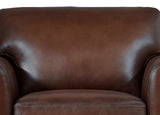 Close-up of a brown leather armchair with a white background