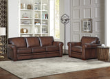 Brown leather sofa and armchair in a living room setting with decorative items on shelves.