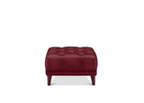 A square tufted ottoman in deep burgundy leather with dark brown wooden legs, shown from the front on a solid white background.