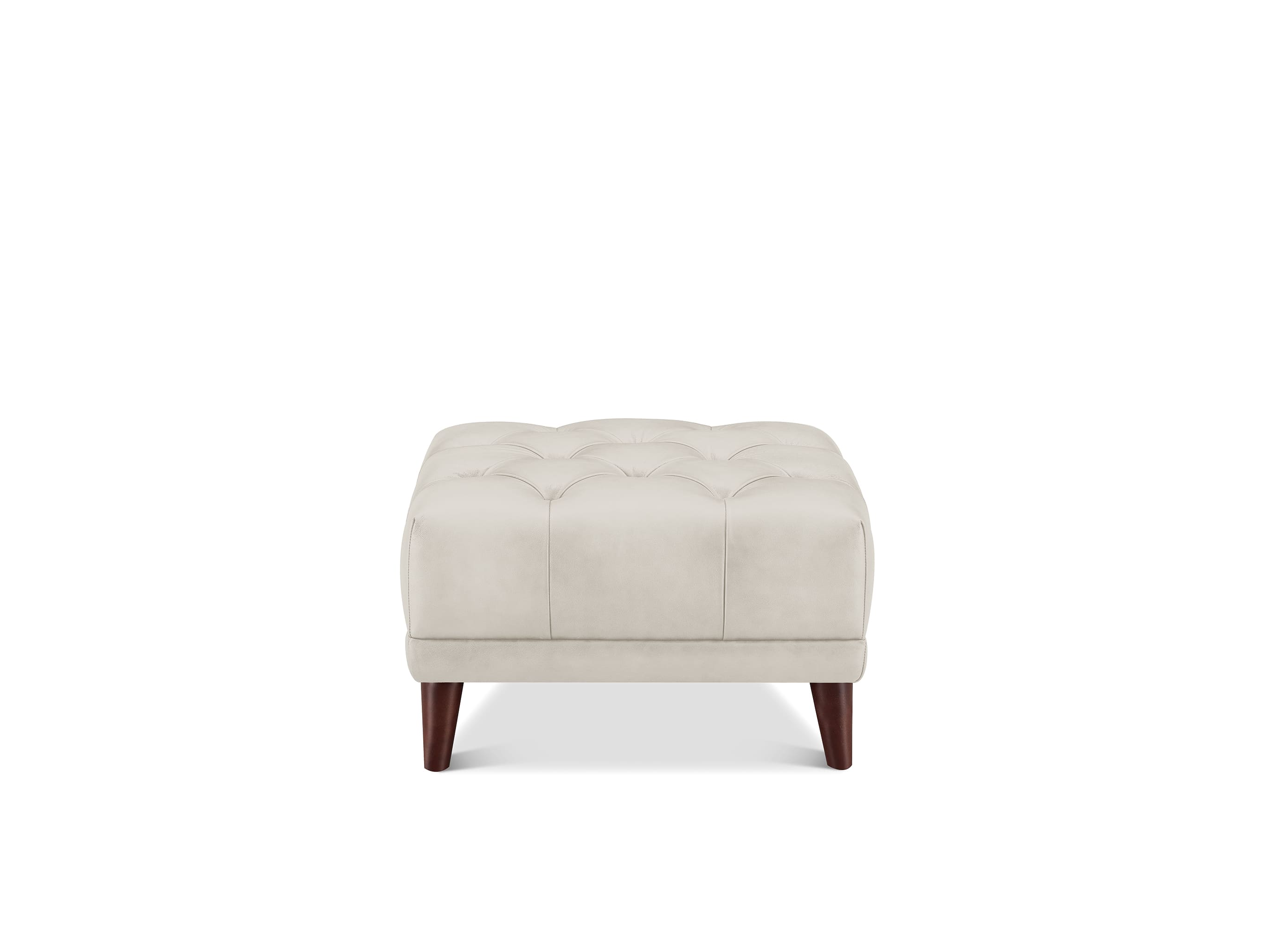 A square tufted ottoman in a light beige fabric, supported by four dark brown wooden legs, shown against a plain white background.