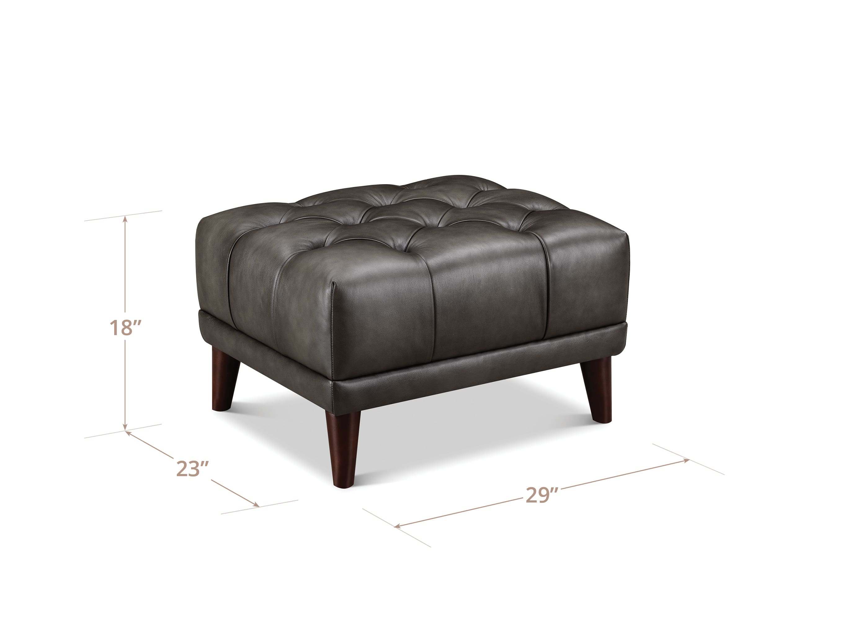 A dark brown tufted leather ottoman with wooden legs, shown on a white background with dimension lines indicating its height of 18 inches, width of 23 inches, and depth of 29 inches.