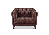 A classic Chesterfield-style armchair upholstered in dark brown leather, featuring deep button tufting on the backrest and seat, rolled arms, and tapered wooden legs, shown against a plain white background.