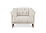 A cream-colored tufted armchair with dark brown wooden legs, shown from a front-facing perspective on a solid white background.