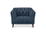 A navy blue tufted armchair with dark brown wooden legs, shown from a front-facing perspective on a solid white background.
