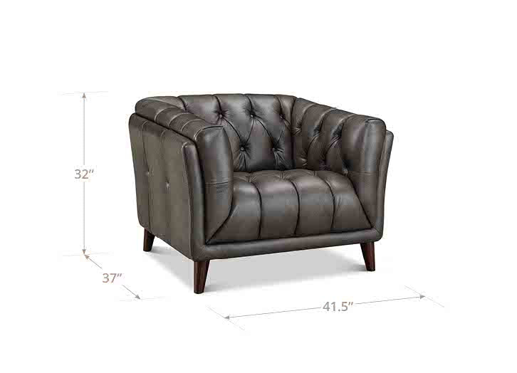 Gray tufted armchair with dimensions on a white background
