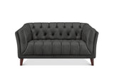A dark gray tufted loveseat sofa with dark brown wooden legs, shown from a front-facing perspective on a white background.